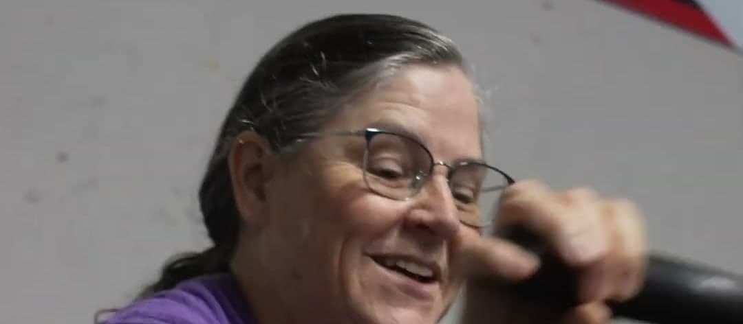 Julia mid-row, smiling, in a purple Misfit shirt