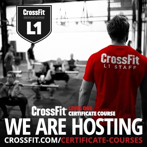 A coach in an L1 Staff shirt overseeing a class at the CrossFit Level 1 Certificate Course we host